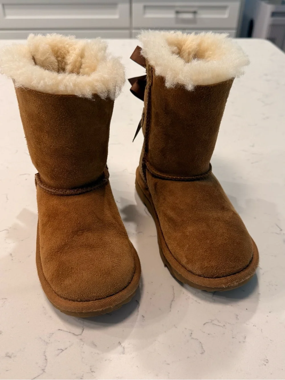 UGG Kids Cozy Faux-Shearling Brown Boots with Bows